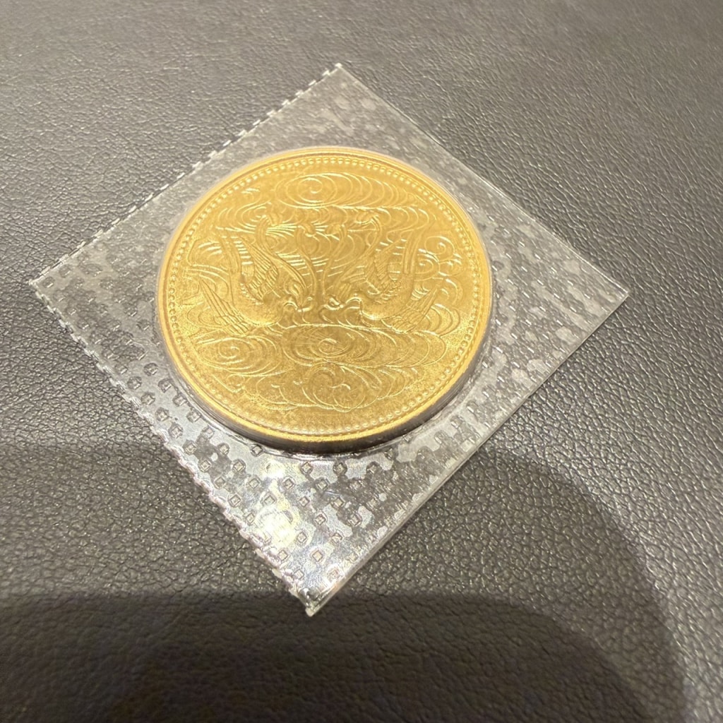 天皇陛下御在位60年記念 10万円金貨