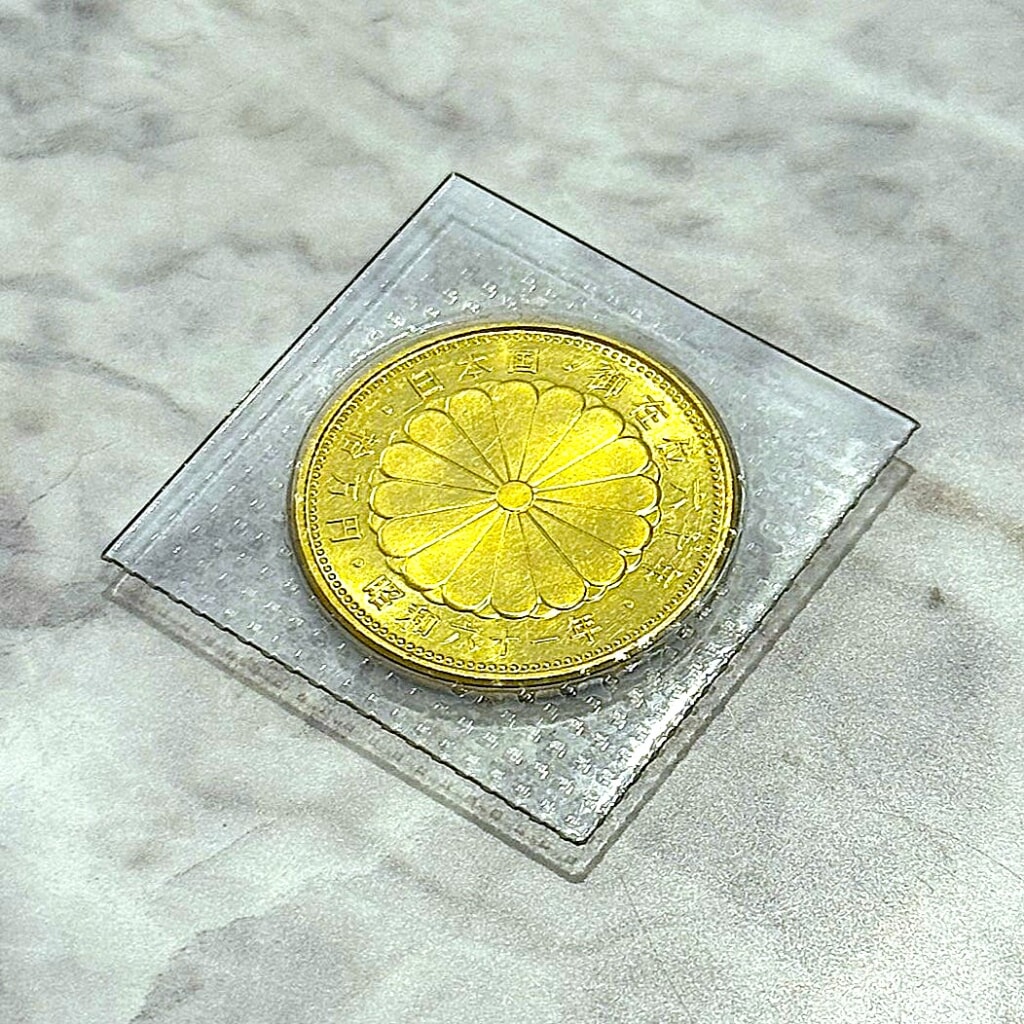 天皇陛下御在位60年記念10万円金貨